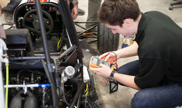 Student working on a vehicle prototype